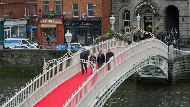 Marking the 200th anniversary of the Ha’penny bridge Mayor of Dublin Críona Ní Dhálaigh had a ceremonial crossing of the bridge with David Windsor, descendent of John Windsor who designed the bridge, and Melanie Cunningham, descendent of former mayor of Dublin John Claudius Beresford who commissioned the bridge, and John Flanagan of Dublin City Council. Photograph: Brenda Fitzsimons/The Irish Times