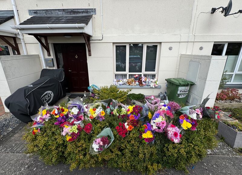 Floral tributes and soft toys at the scene in the Heathfield Estate, Finglas, where the remains of Krzysztof Daczkowska (50) and his daughter Julia (5) were discovered on Saturday night. Photograph: Stephen Collins/Collins Dublin