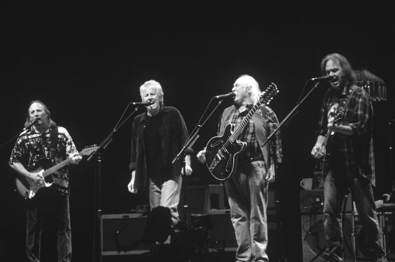 Stephen Stills, Graham Nash, David Crosby, and Neil Young performing in 2000. Photograph: Tim Mosenfelder/Getty Images