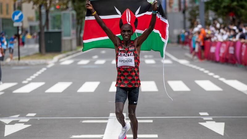 Kenya’s Eliud Kipchoge celebrates winning the men’s marathon. Photo: Morgan Treacy/Inpho