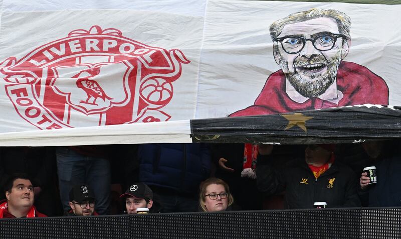 Fans hold a tribute to Liverpool manager Jurgen Klopp ahead of the English FA Cup fourth round clash with Norwich City. Photograph: Paul Ellis/AFP