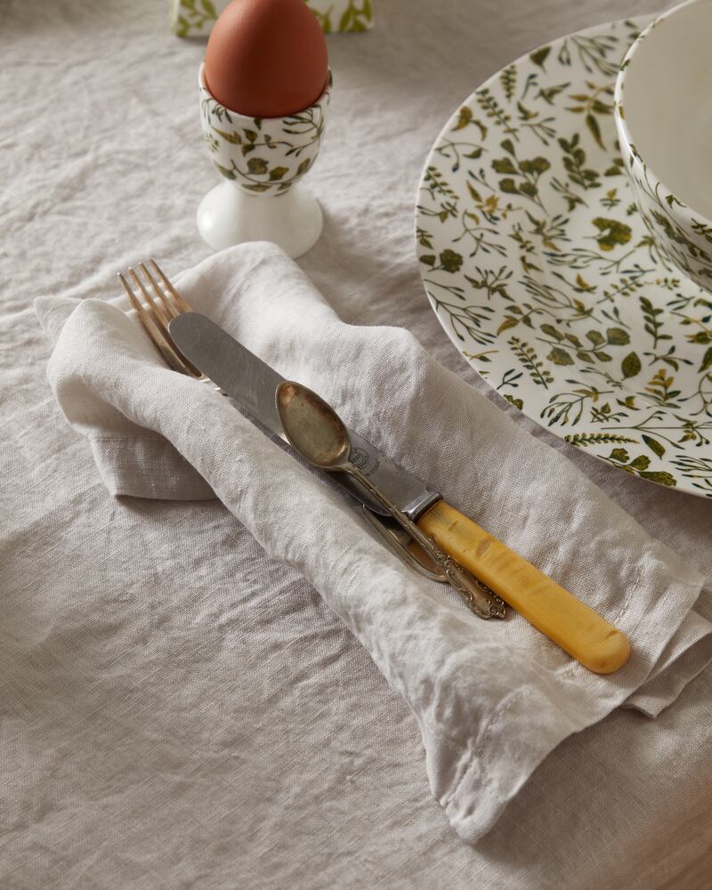 An inviting table settling from Foxford including linen table cloth (€69), linen table napkins (€29), meadows egg cup (€5.99), bowl (€16.99) and plate (€18.99).