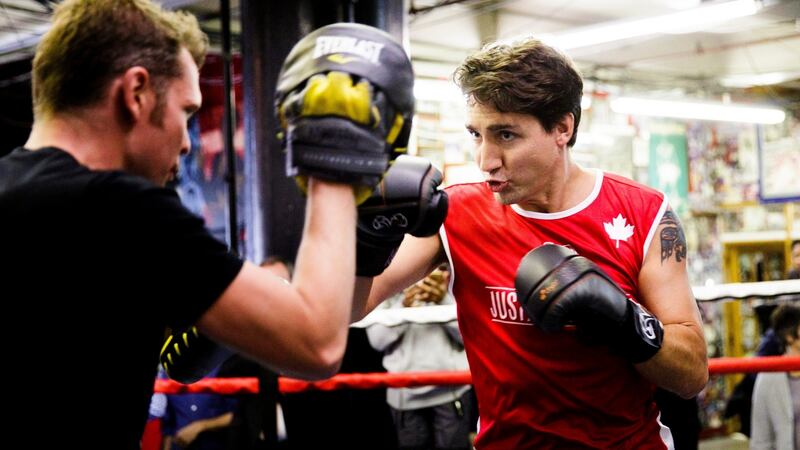 A blow: Canadian prime minister Justin Trudeau (right) spars with Yuri Foreman at Gleason’s Gym in New York. Trudeau had to cancel his trip to Brussels to sign the EU-Canada trade deal this week. Photograph: Justin Lane/EPA