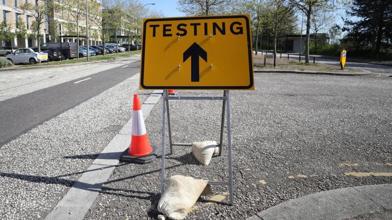 A road sign points the way to  pilot coronavirus Covid-19 testing site in Milton Keynes, England on Monday. Photograph:  Catherine Ivill/Getty )
