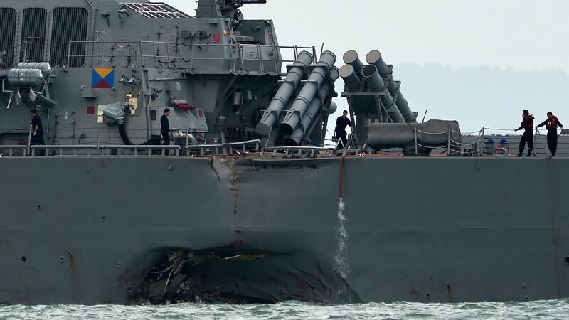 Destroyer USS John S McCain is seen with a hole on its portside after a collision with an oil tanker outside Changi naval base in Singapore on Monday. Photograph:  Roslan Rahman/AFP/Getty