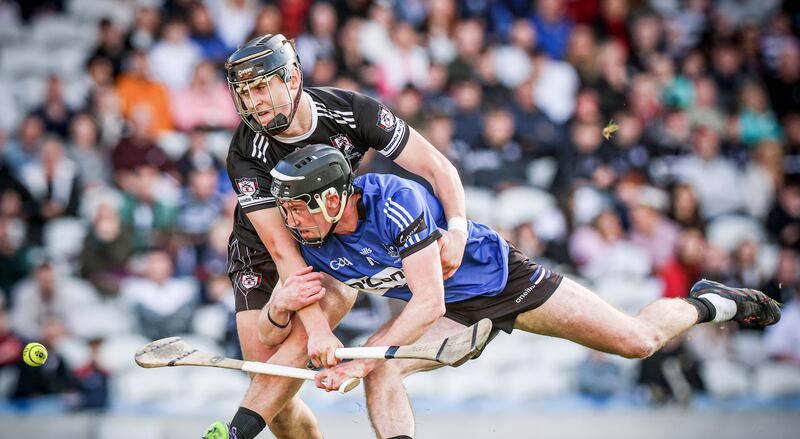 Sarsfields' Jack O'Connor is challenged by Tadgh O'Leary of Midleton during the final. Photograph: Tom Maher/Inpho