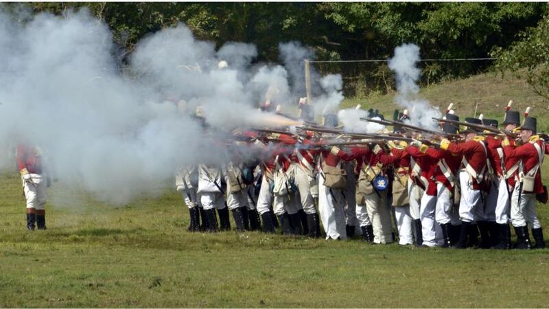 Redcoats open fire on the rebels during yesterday’s re-enactment of the Battle of Vinegar Hill. Photograph: Brenda Fitzsimons