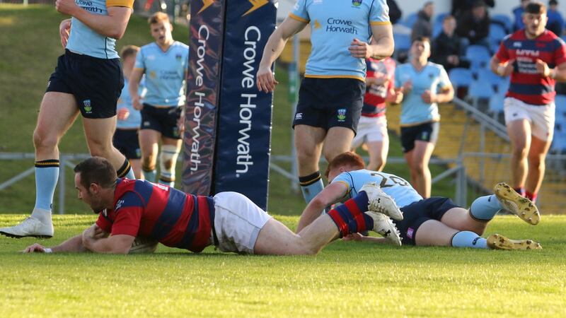 Clontarf’s Rob McGrath scores a try in the Ulster Bank League Division 1A title against UCD at Belfield. Photograph: Ben Whitley/Inpho