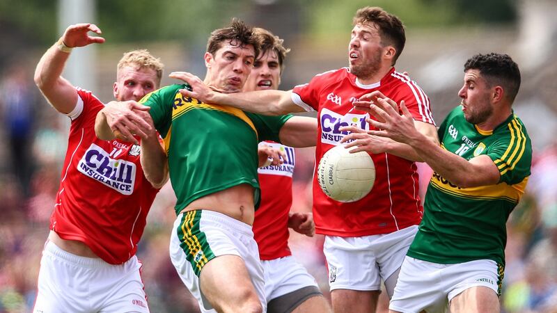 Kerry’s David Moran and Michael Geaney with Ruairi Deane and Tomas Clancy battle with of Cork. Photo: Cathal Noonan/Inpho