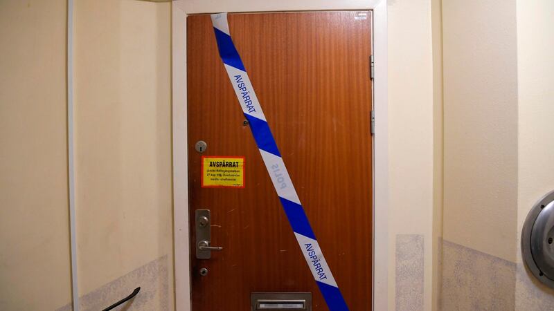 Barrier tape of the police is fixed on the door of the apartment in Haninge, south of Stockholm, where a man in his 40s, who was kept locked in by his mother, was found. Photograph: Jonathan Nackstrand/AFP via Getty Images