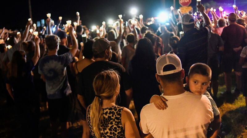 Local residents embrace during a candlelight vigil for victims of a mass shooting in a church in Sutherland Springs, Texas, U.S., November 5, 2017. Photograph: REUTERS/Mohammad Khursheed