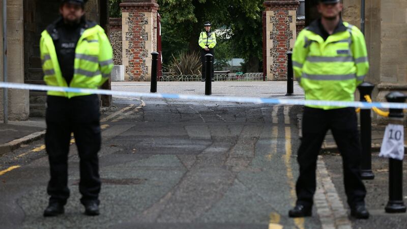 Police at the Abbey gateway of Forbury Gardens in Reading town centre following a multiple stabbing attack in the gardens. Photograph: Jonathan Brady/PA Wire