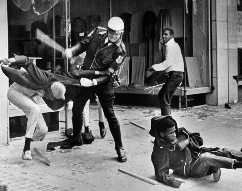 A police officer uses his nightstick on a youth reportedly involved in the looting that followed the breakup of a march led by Dr Martin Luther King jnr on  March 28th, 1968, in Memphis, Tennessee. Photograph:  Jack Thornell/AP