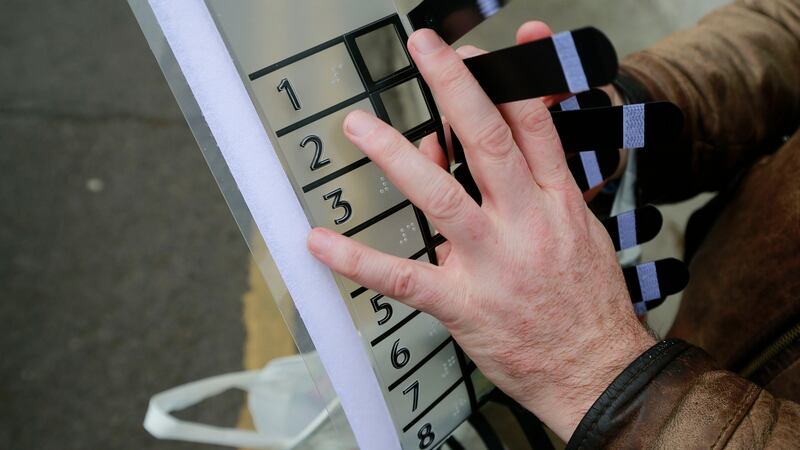 Robbie Sinnott with the template he used to help negotiate his ballot paper. Photograph: Nick Bradshaw/The Irish Times