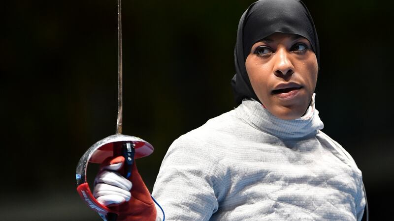 Ibtihaj Muhammad reacts competing against France’s Cecilia Berder in their women’s individual sabre qualifying bout as part of the fencing event of the Rio 2016 Olympic Games, on August 8th.  Photograph: FABRICE COFFRINI/AFP/Getty Images