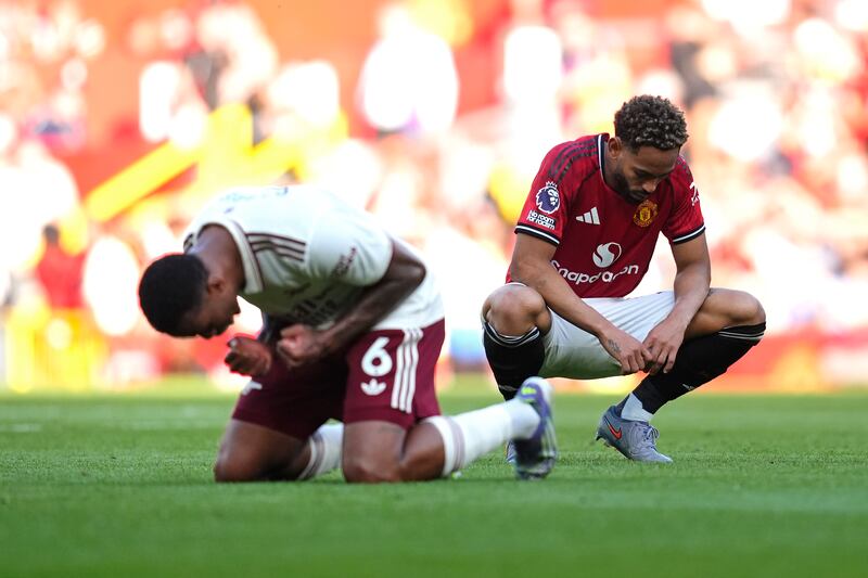 Manchester United's Matheus Cunha (right) dejected as Arsenal's Gabriel celebrates after the final whistle. Photograph: Nick Potts/PA