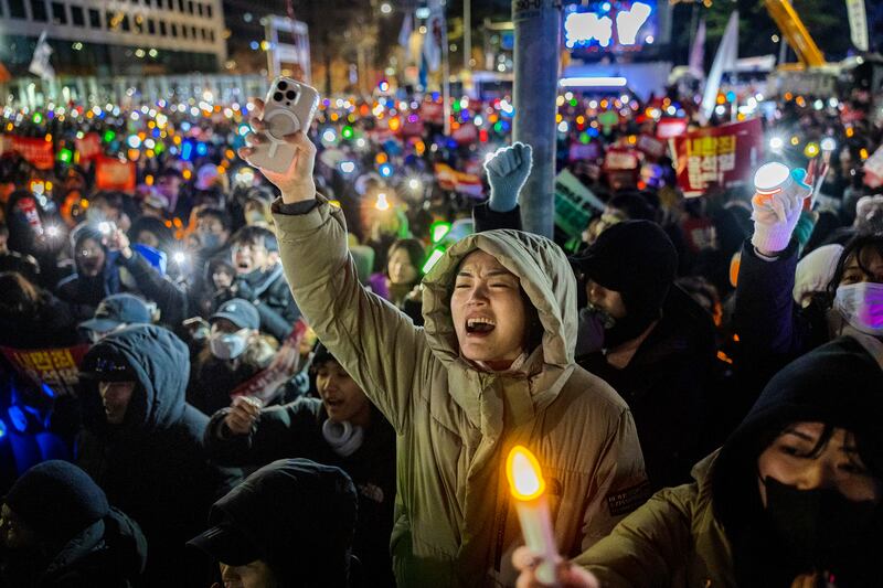 Protesters take part in a demonstration last December in Seoul against Yoon Suk Yeol, then president. Photograph: Ezra Acayan/Getty