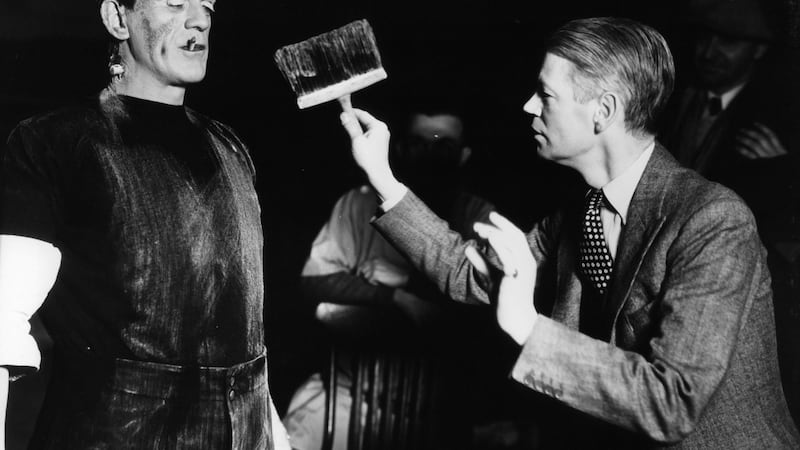 Boris Karloff with cigarette is dirtied by director James Whale in between scenes from the film ‘Frankenstein’, 1931. Photograph:  Universal/Getty Images