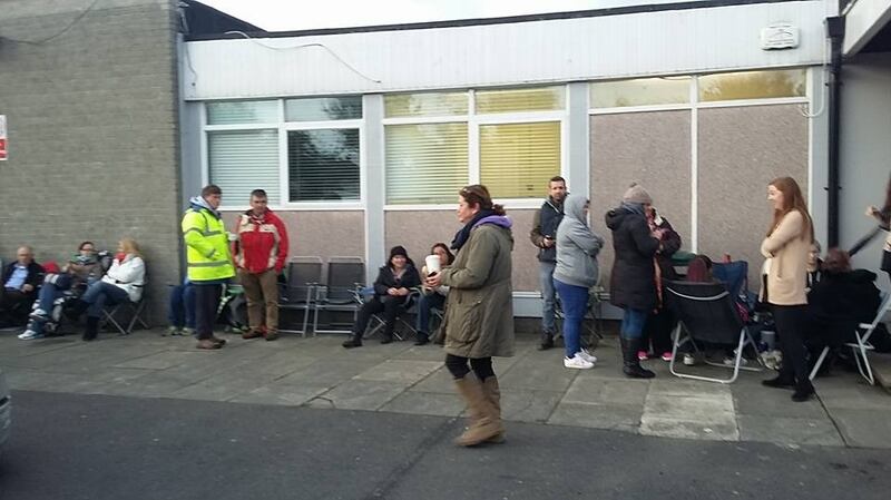 Parents queue outside Clonturk Community College, in Whitehall, Dublin, in order to secure school places for their children. Photograph: Clonturk Community College/Facebook