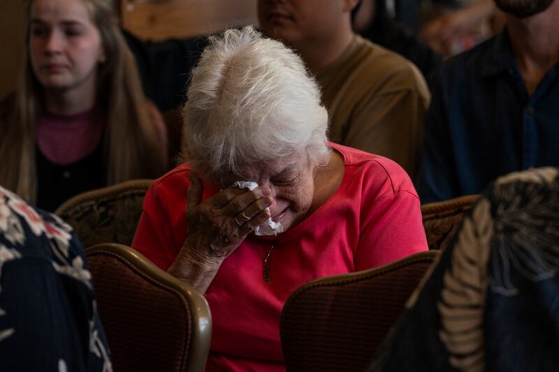 An attendee cries during a church service held in a coffee shop in Lahaina on Sunday. Photograph: Go Nakamura/New York Times