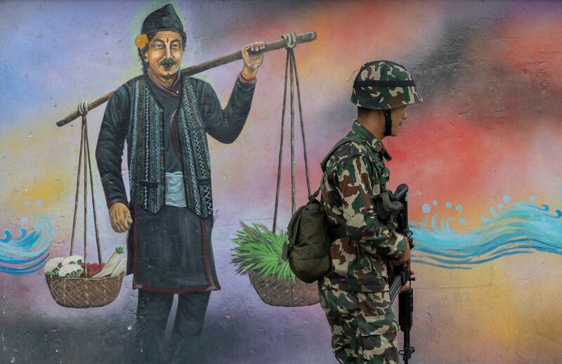 A Nepalese army member on patrol in Kathmandu. Photograph: Narendra Shrestha/ EPA

