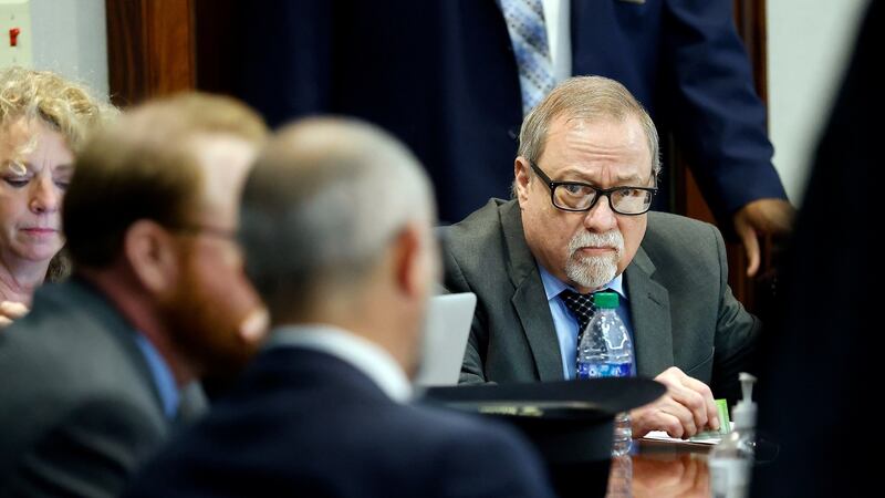 Greg McMichael (right) waits for the sentencing  in the Glynn County courthouse, in Brunswick, Georgia. Photograph: Stephen B Morton/Pool/Getty