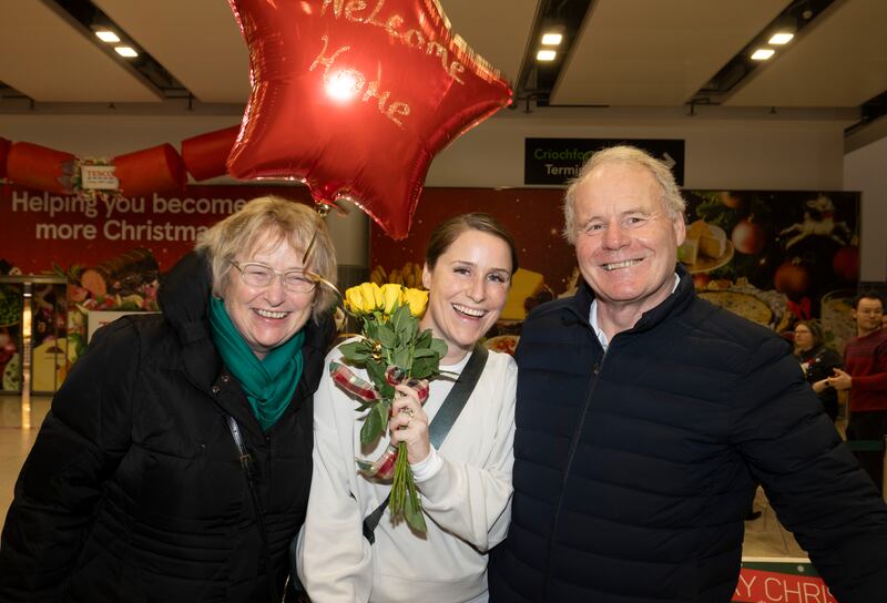  Peter and Orla McNally from Castleknock welcoming their daughter Anna home from Canada for Christmas  at Dublin Airport. Photograph: Alan Betson / The Irish Times

