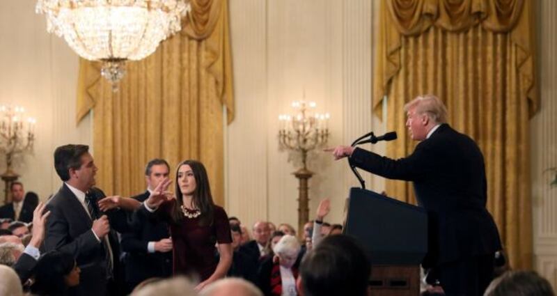 A White House intern reaches for the microphone held by CNN’s Jim Acosta as he questions US president Donald Trump during a news conference on November 7th, 2018. Photograph: Jonathan Ernst/Reuters