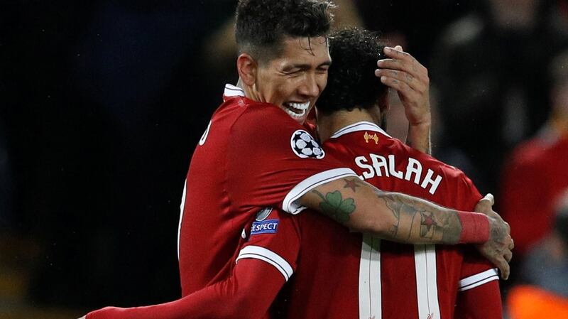 Reds vs Real: Liverpool’s Roberto Firmino celebrates scoring the side’s fourth goal with Mohamed Salah in their Champions League semi-final win over AS Roma on April 24th. Photograph: Reuters/Phil Noble
