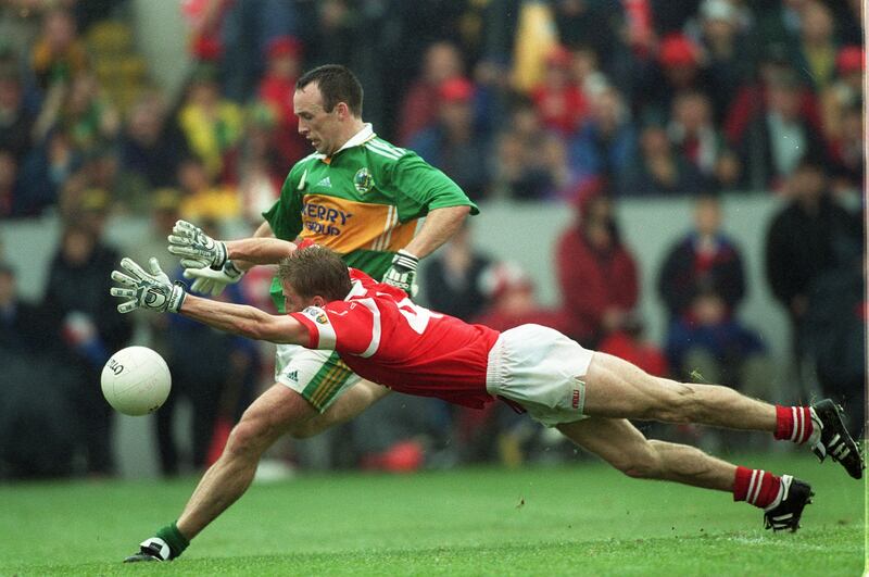 Home-grown rivalries: Cork's Anthony Lynch blocks a kick by Kerry's John Crowley during the 1999 Munster football final. Photograph: Patrick Bolger/Inpho