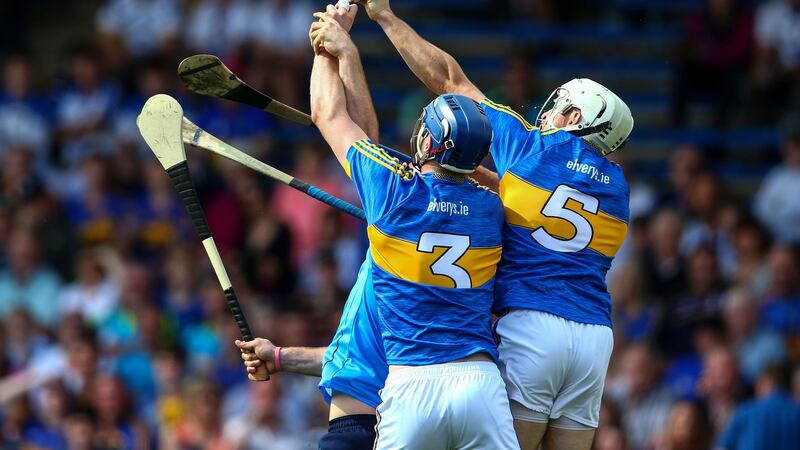 Tipperary’s Tomás Hamill and Joe O’Dwyer shut the door on Dublin’s  Ryan O’Dwyer during the qualifier win at Thurles. Photograph: Cathal Noonan/Inpho
