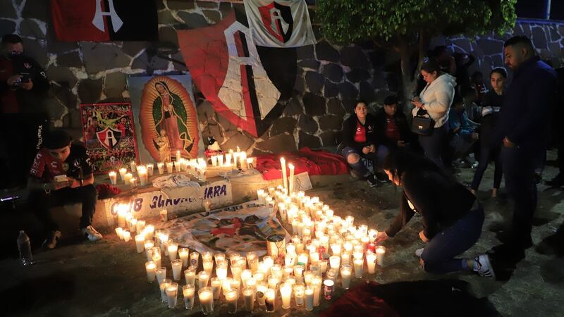 Fans of Club Atlas take part in a vigil in the surroundings of Jalisco stadium in Guadalajara after the violent clashes during the game against Querétaro. Photograph: Fabricio Atilano/EPA