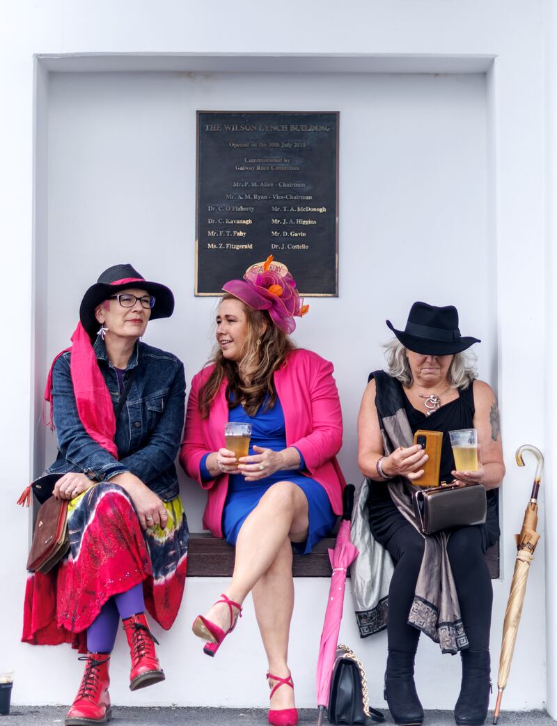 Jennifer Toal, Lisa Waldron and Lisa George from Castlerea in Co Roscommon enjoy a break during the Galway Races on Monday. Photograph: James Crombie/Inpho