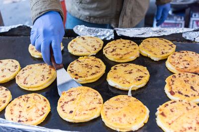 The kids tentatively embraced the new cuisine, eating arepas, a fried cornmeal bread