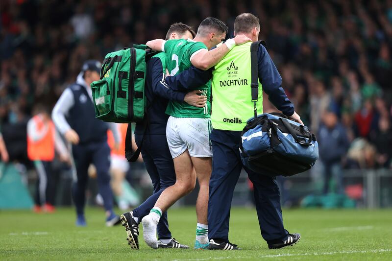 Limerick's Sean Finn receiving medical attention in the Munster  Championship against Clare at the Gaelic Grounds, Co Limerick, on April 29th, 2023.  Photograph: Bryan Keane/Inpho