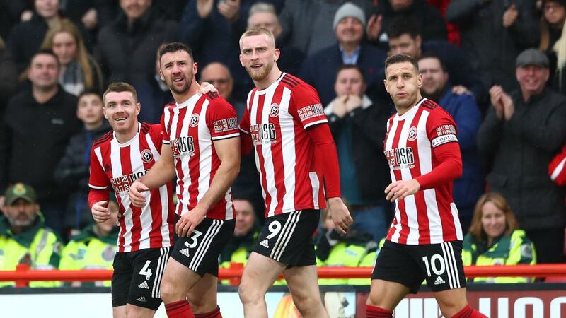 Enda Stevens  (second from left) celberates with his  Sheffield United  team-mates after scoring his team’s first goal during the Premier League match between against Brighton  at Bramall Lane. Photograph: Matthew Lewis/Getty Images