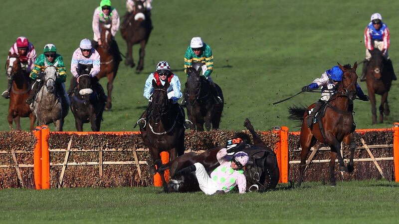 Ruby Walsh and Benie Des Dieux fall at the final fence during the OLBG Mares’ Hurdle at  Cheltenham. Photograph: Michael Steele/Getty Images