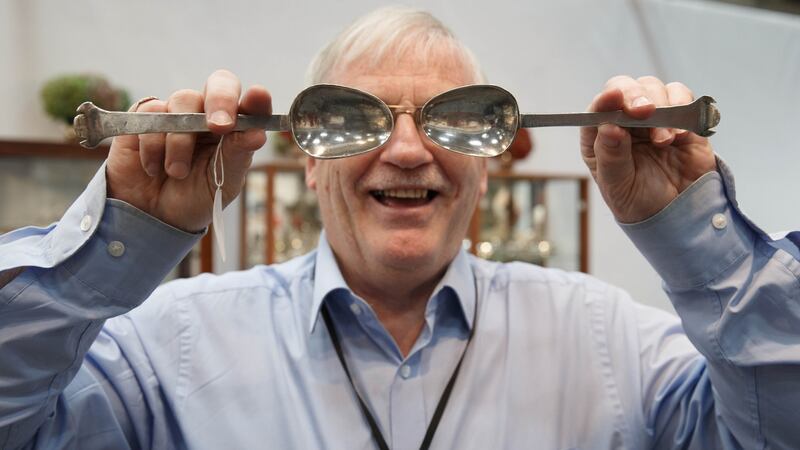 Jimmy Weldon with a pair of Irish silver spoons made by Sir Abel Ram in 1663 which he has for sale for €35,000. Photograph: Fran Veale