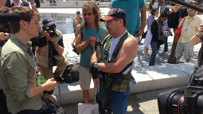 A man carries an AR-15-style weapon as he attends an “open carry”  event in Cleveland. The city’s police union asked for a suspension of the open carry law but the state’s Republican governor John Kasich said he did not have the authority to do so. Photograph: Ivan Couronne/AFP/Getty Images