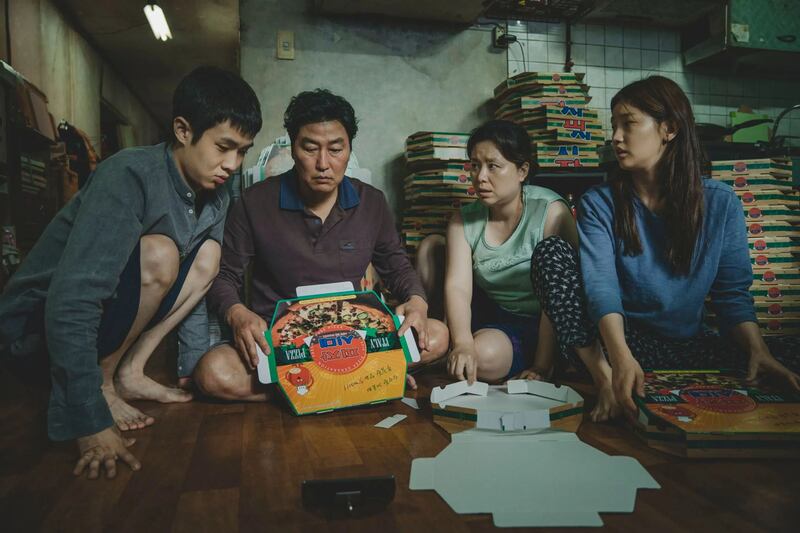 Song Kang-ho, Jang Hye-jin, Choi Woo-sik and Park So-dam in Parasite, directed by Bong Joon-ho.