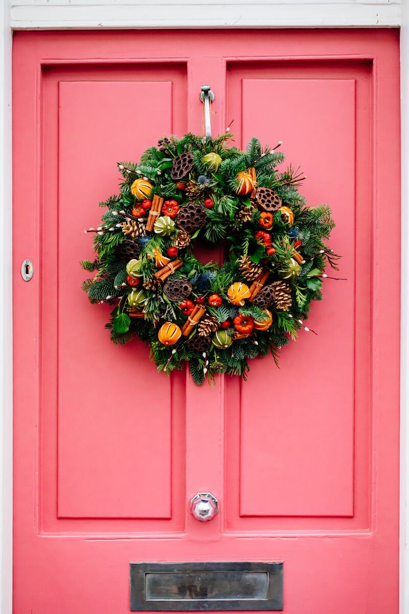 Dried orange slices, cinnamon sticks, ornamental berries and pine cones are traditional elements that can add a real Christmassy feel to your wreath. Photograph: iStock