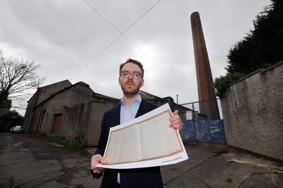 Dr Mark Coen, co-editor of a book on the Donnybrook Magdalene Laundry,  holding copies of a Ledger from the laundry from the 1980s. Photograph: Alan Betson

