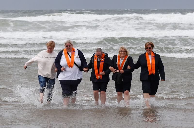 Taking a dip during the Rossnowlagh Orange Order parade gathering in Co Donegal last Saturday. Photograph: Nick Bradshaw