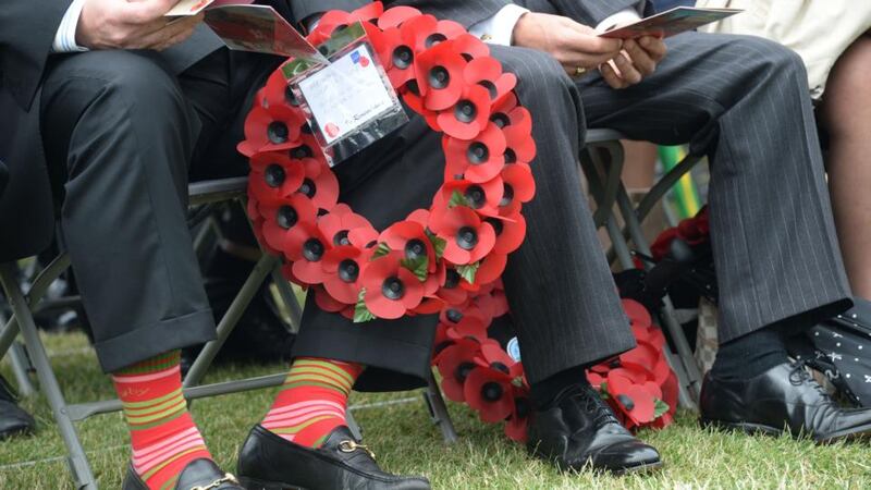 A man holds a wreath at the annual Ceremony of Remembrance, organised by the Royal British Legion, Republic of Ireland, at the National War Memorial Gardens in Islandbridge on Saturday. Photograph: Dara Mac Dónaill/The Irish Times