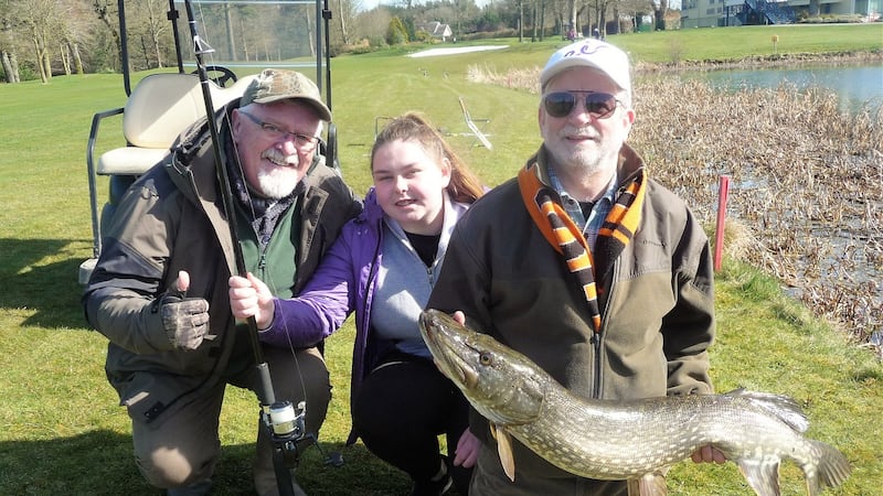 Louise Shelvin (16) from James’s St CBS  with a 20lb pike alongside K Club fishery manager John O’Neill (left) and Ciarán Ward