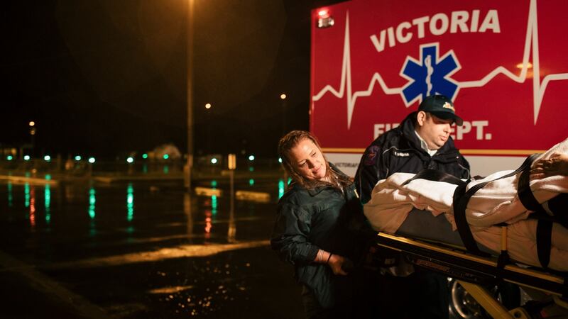 Jami Leifeste, an emergency medical technician, is helped by a co-worker as they evacuate a patient from Citizens Medical Center to another hospital, in Victoria, Texas. Photograph: Alyssa Schukar/New York Times