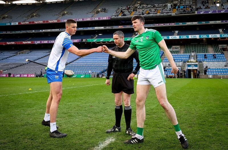 Captains Conor Prunty and Declan Hannon with referee Fergal Horgan  for the toss. Photo: James Crombie