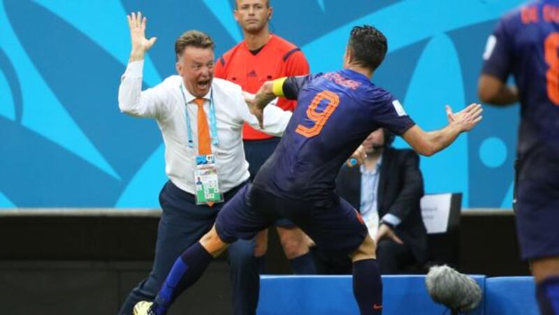 Netherlands coach Louis Van Gaal celebrates the first goal with  Robin van Persie  during the 2014 Fifa World Cup Brazil Group B match against Spain  at Arena Fonte Nova on June 13th.  Photo by Jean Catuffe/Getty Images