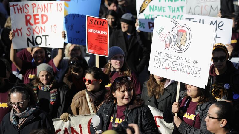 A protest against the mascot for the Washington Redskins: many  believe it  mocks Native American culture and they want the team to change it. Photograph: Hannah Foslien/Getty Images