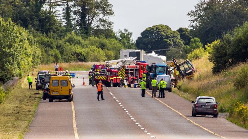 Emergency services  at the scene of a fatal road incident  on the Sligo to Dublin road, near Castlebaldwin, where an articulated truck struck a council-operated hedge trimmer, killing one worker. Photograph: James Connolly/PicSell8